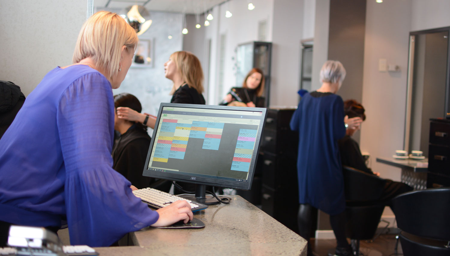 Staff using Timely salon software