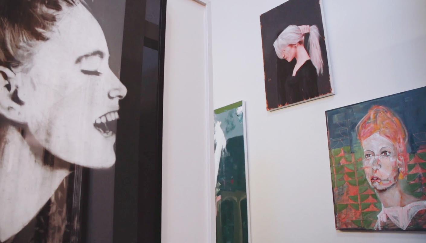 Exuberant artwork hangs on the walls at Moha Hairdressing