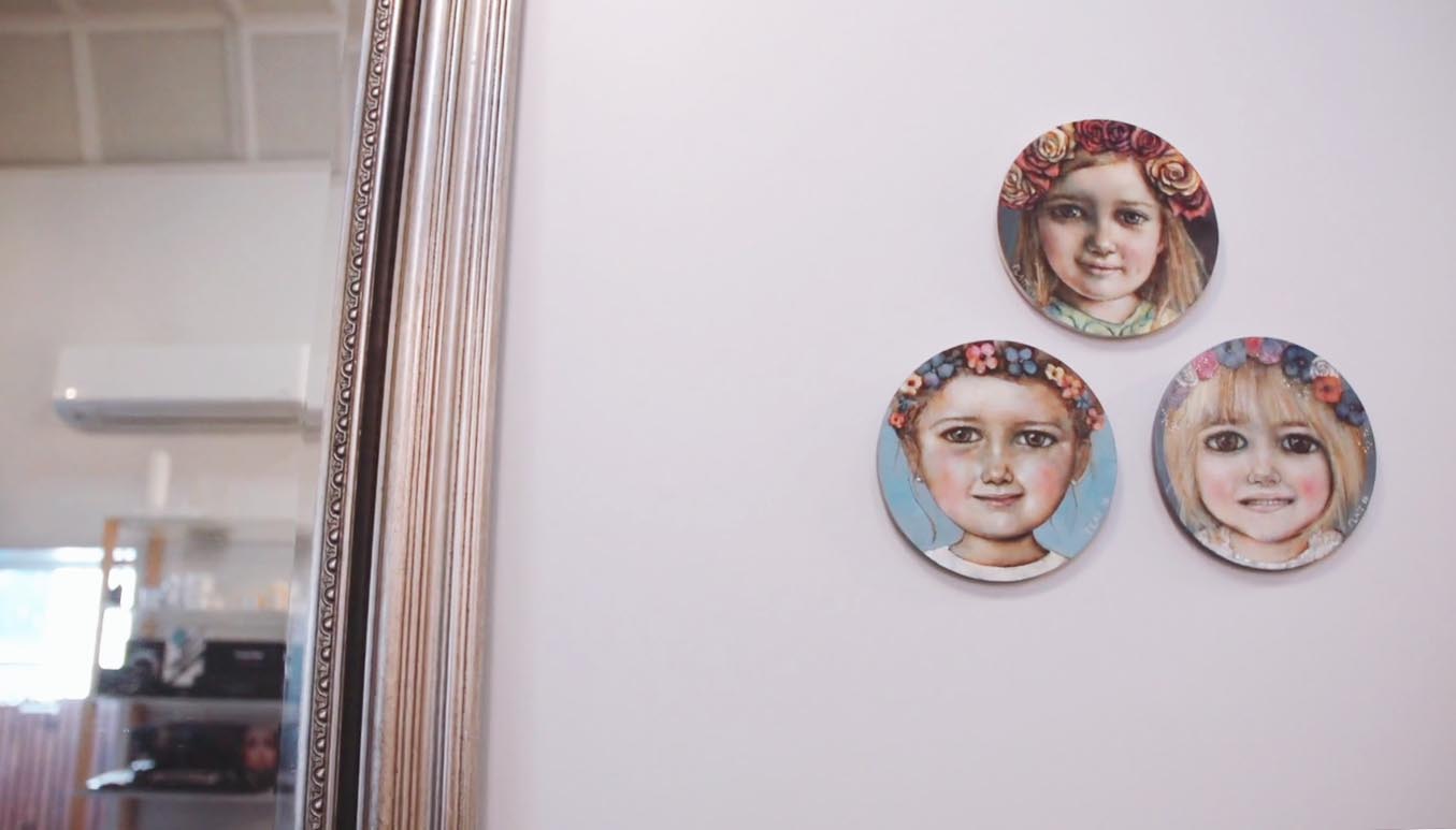 Portraits of their three children take centre stage at Moha Hairdressing.